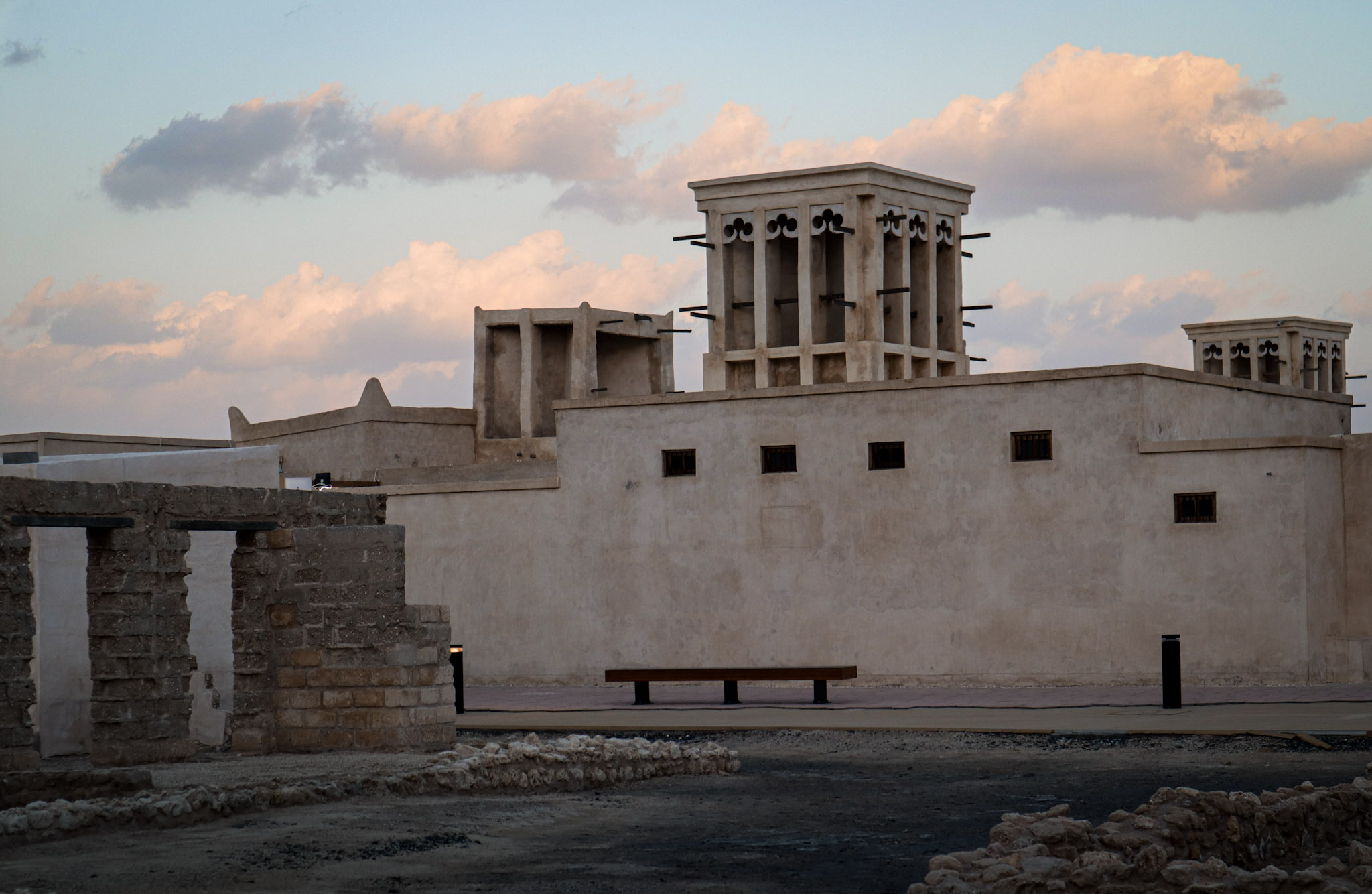 Ruins, restored building, and modern seating and lights visible together in one scene.